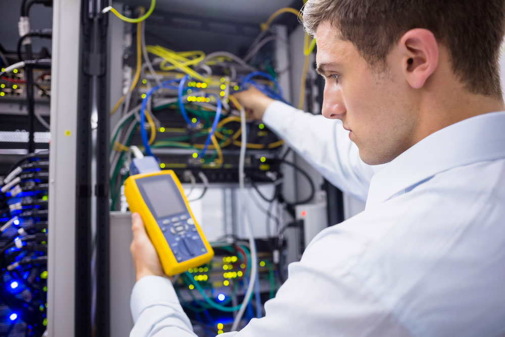 technician using digital cable analyzer