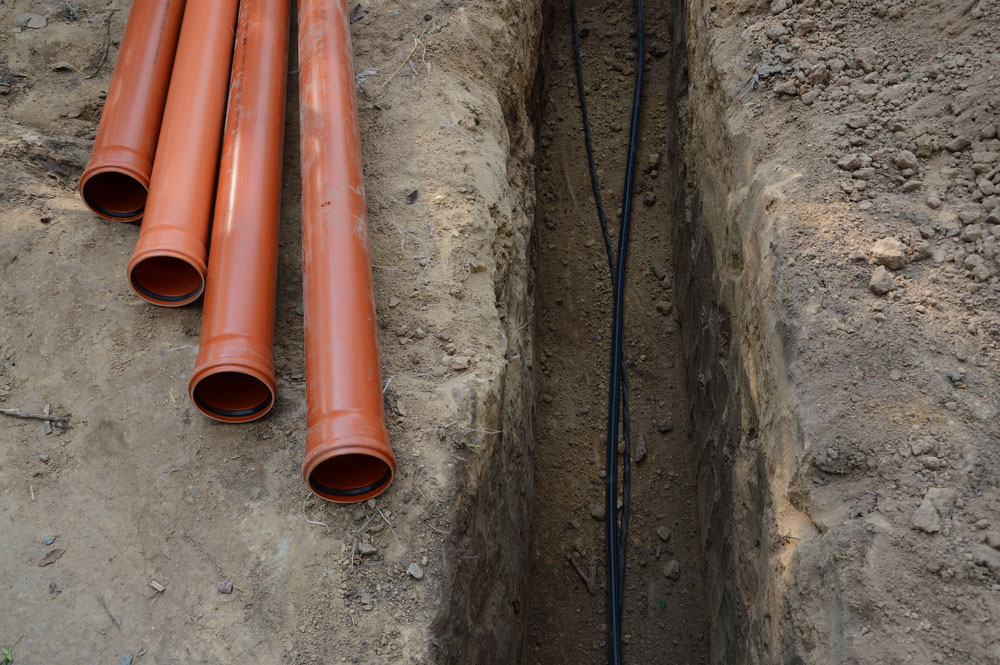 Image: laying of cables and pipes in the trench