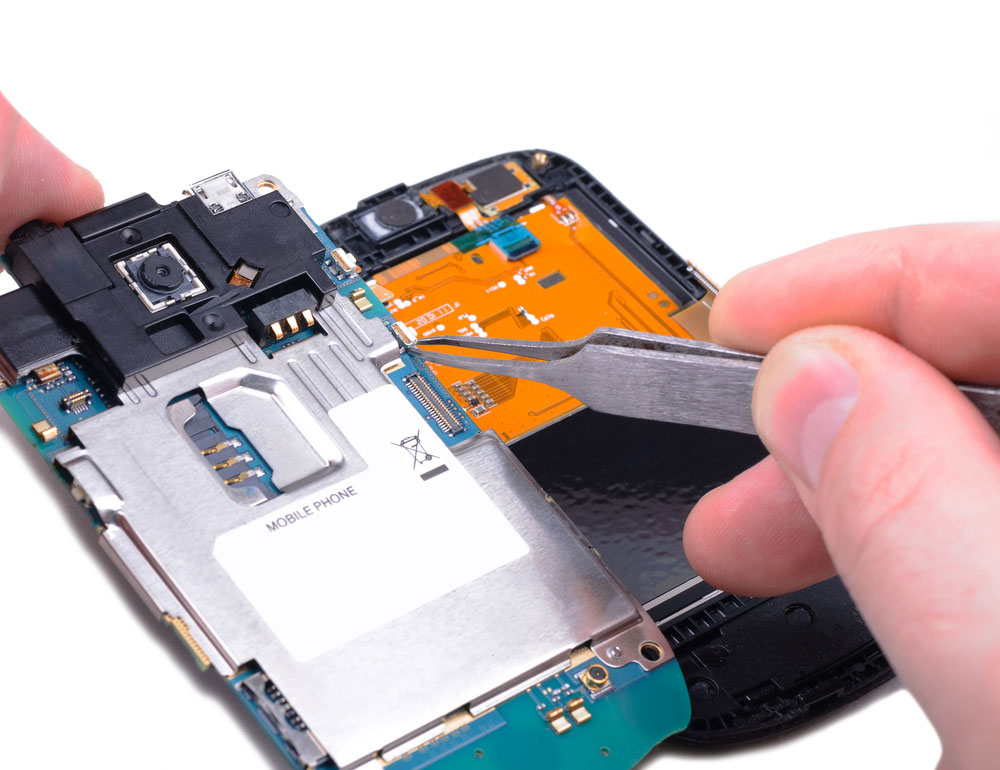Disassembled part of a smartphone showing the PCB